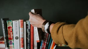 Woman selecting books on the shelf